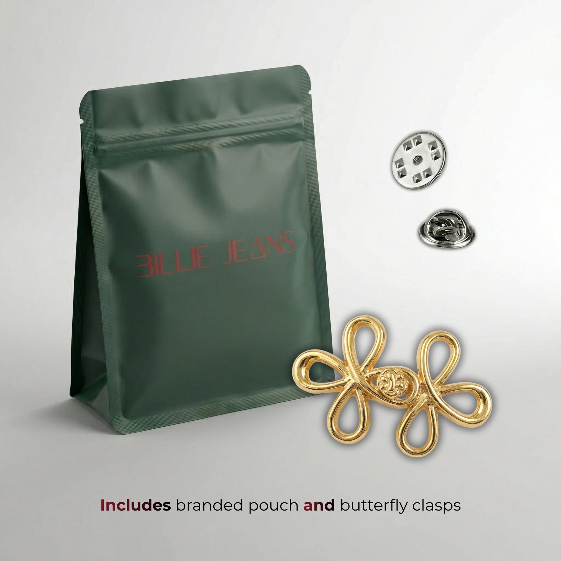 Gold butterfly clasp with branded pouch on a light gray background