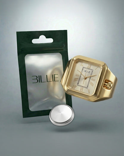 Gold watch with square face, silver button, and green packaging with Billie logo.