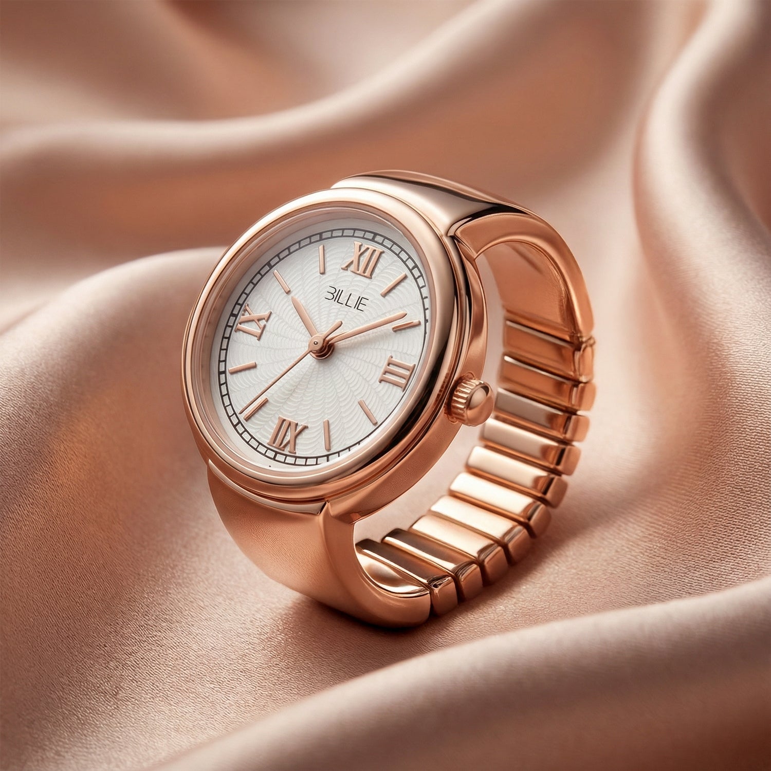 Rose gold watch with white dial on a soft pink fabric background
