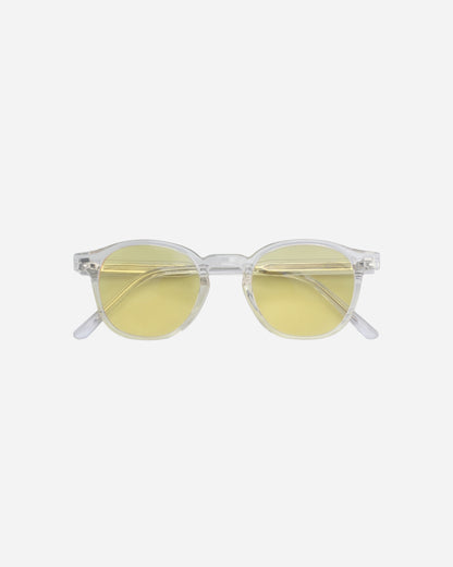 Round sunglasses with clear frames and yellow lenses on a plain background.