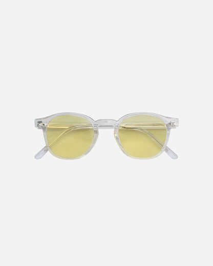 Billie Blue Light Glasses in clear with yellow lenses, round frame on a light background