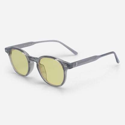 Round sunglasses with yellow lenses and gray frame on a white background