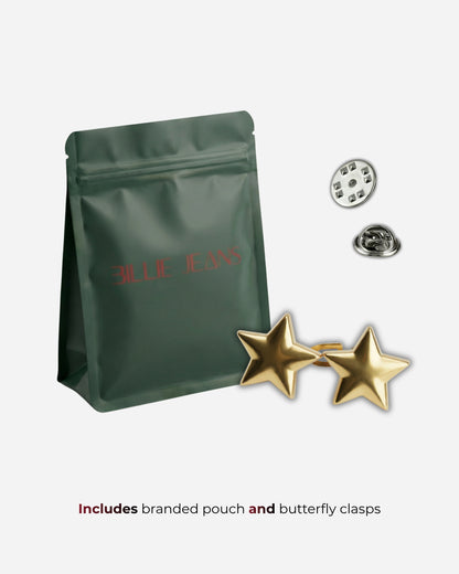 Green pouch with red text, two gold star earrings, and metal clasps on a light background.