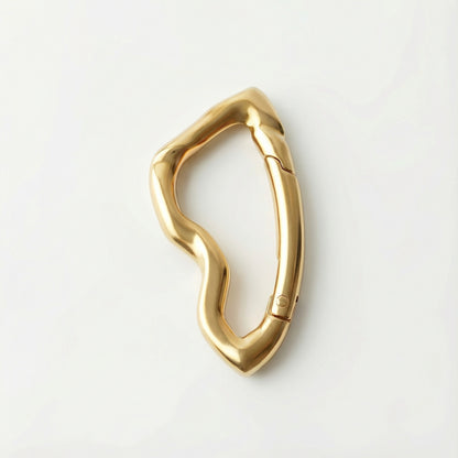 Gold carabiner on a white background