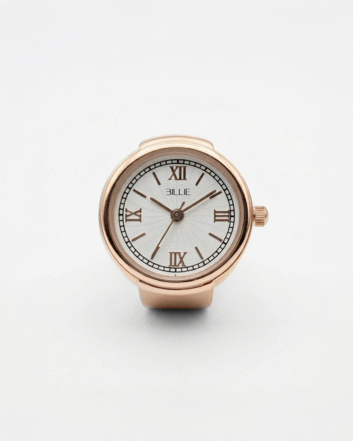 Billie Grace Ring Watch in rose gold, round finger watch with Roman numerals and white dial on a light background