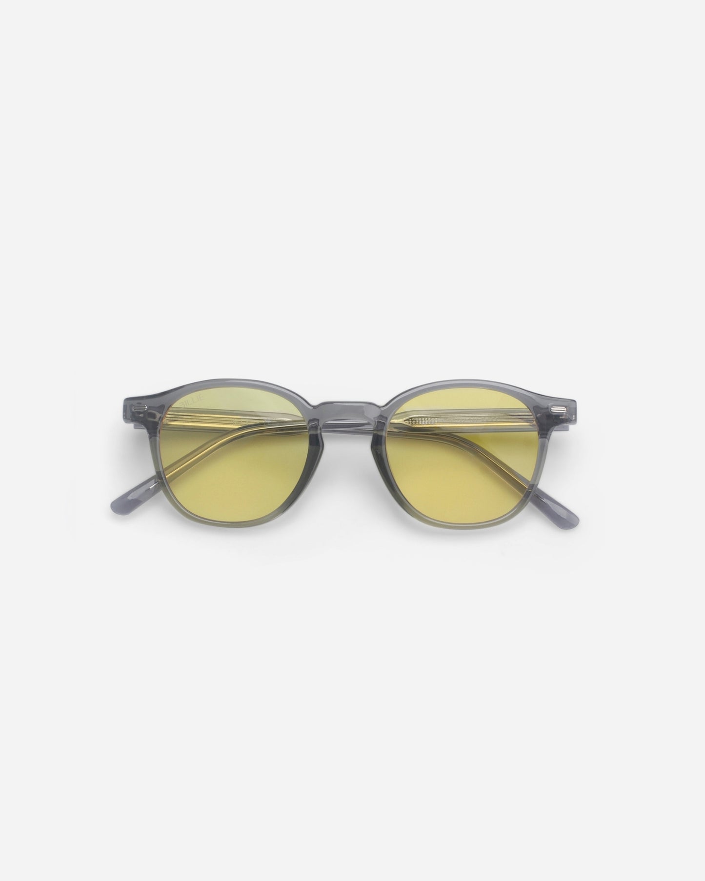 Round sunglasses with yellow lenses on a plain background