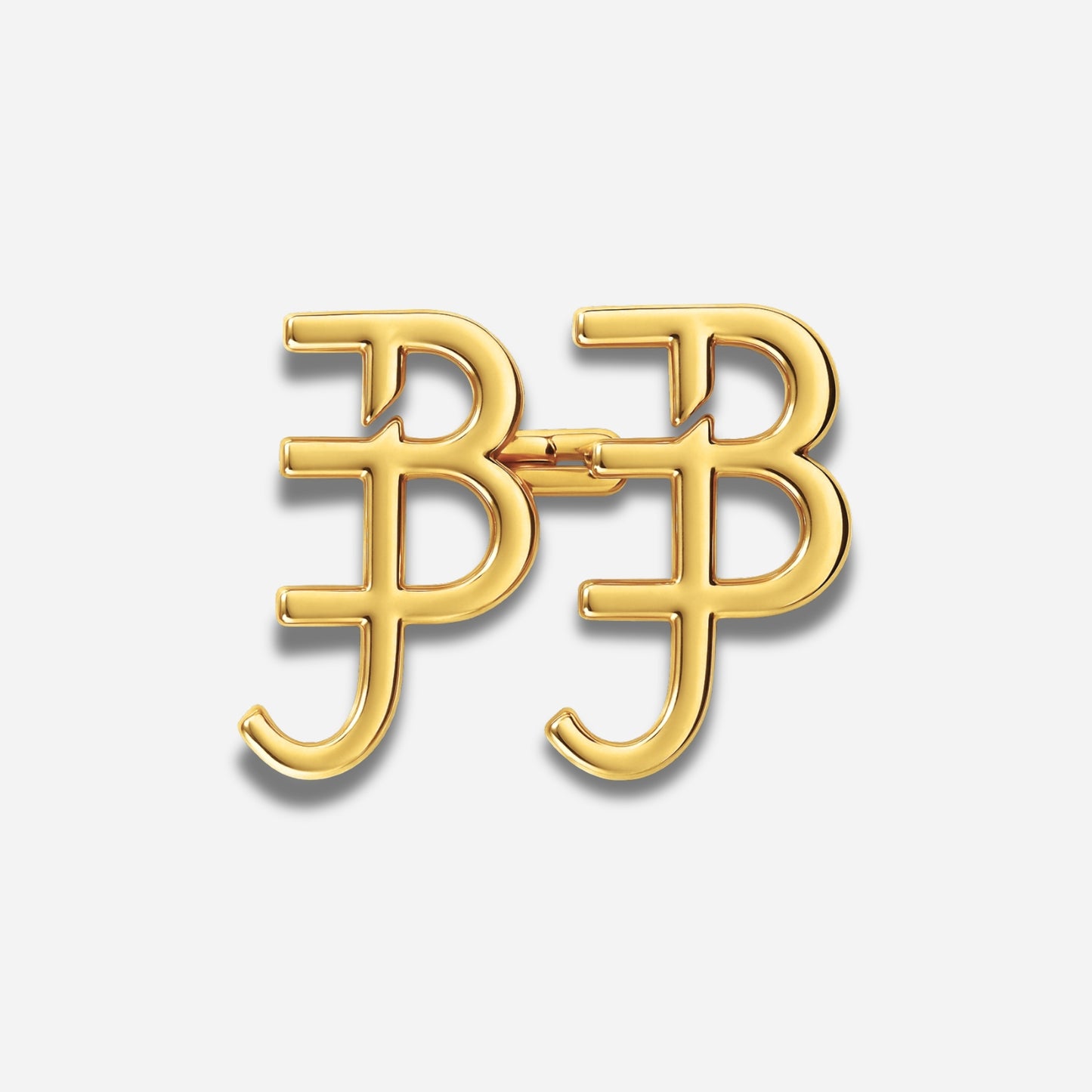 Gouden broche met de initialen 'BB' op een lichtgrijze achtergrond