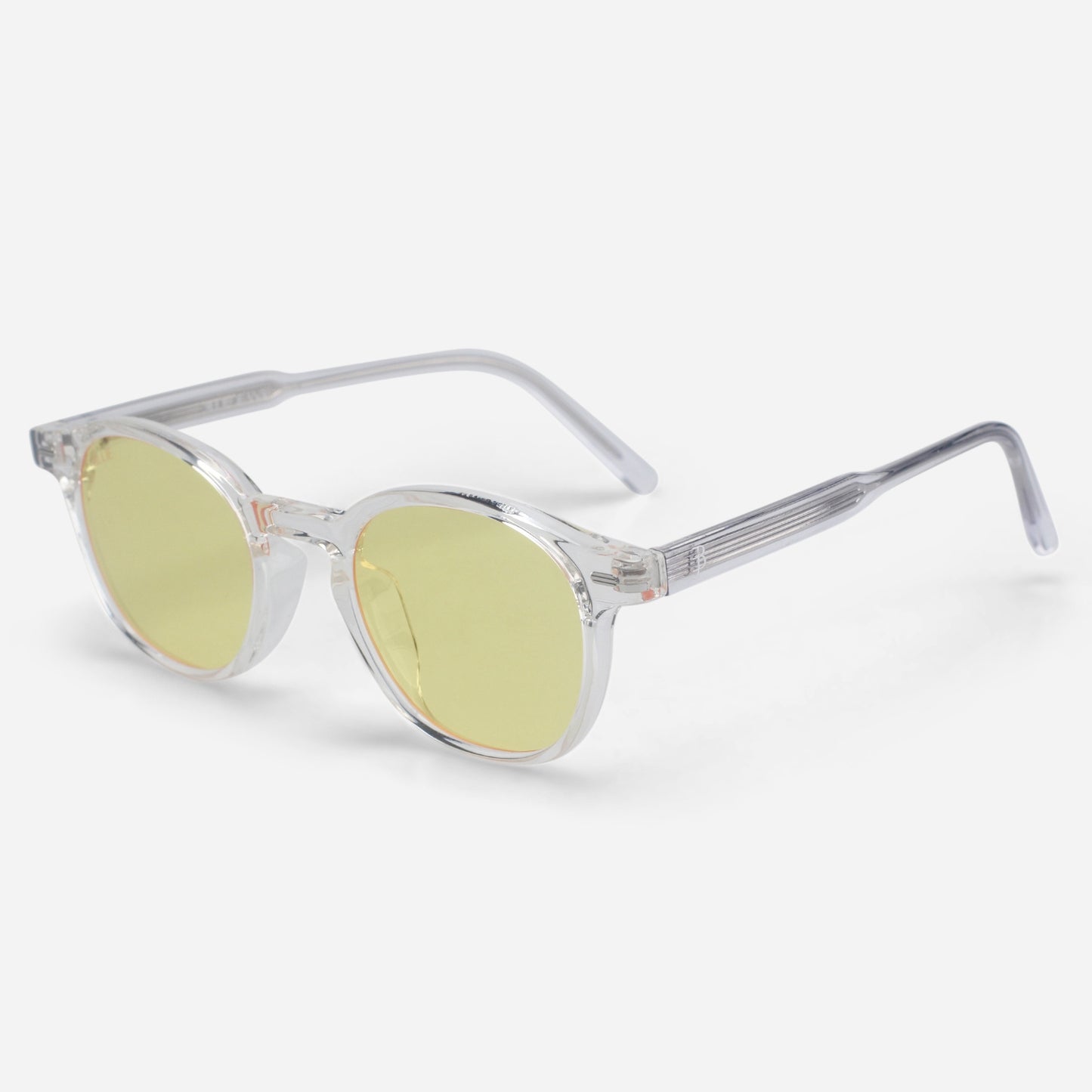 Clear frame Blue light glasses with yellow lenses on a white background