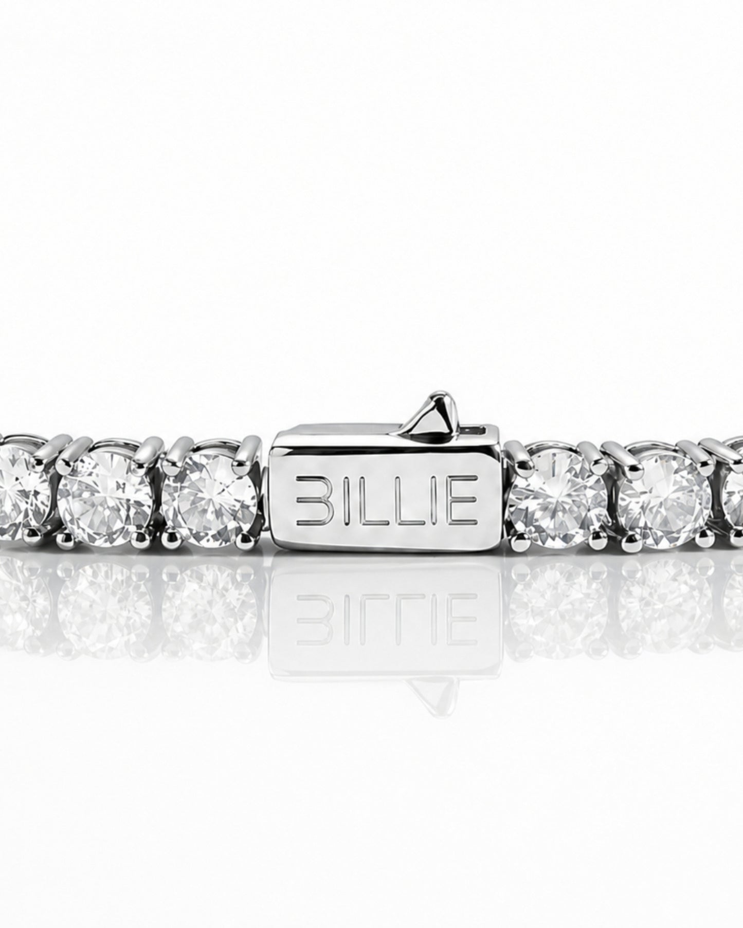 Silver bracelet with circular stones and a clasp marked 'BILLIE'.