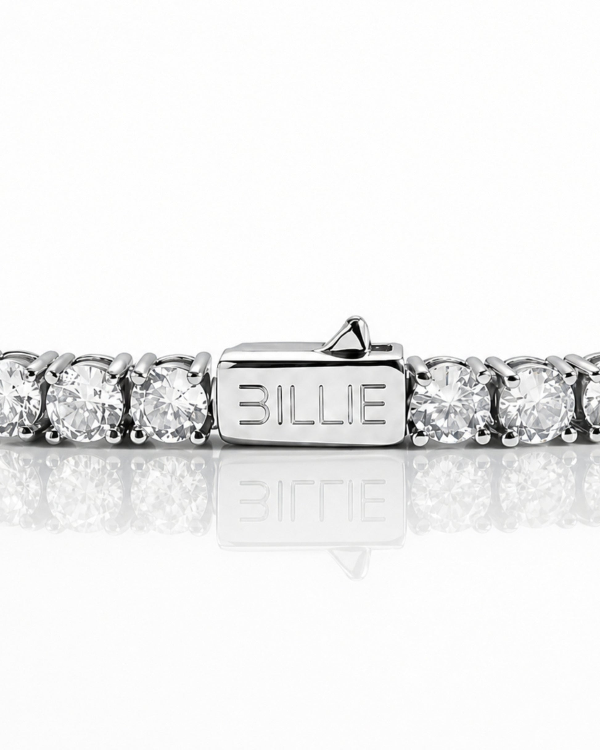 Silver bracelet with circular stones and a clasp marked 'BILLIE'.