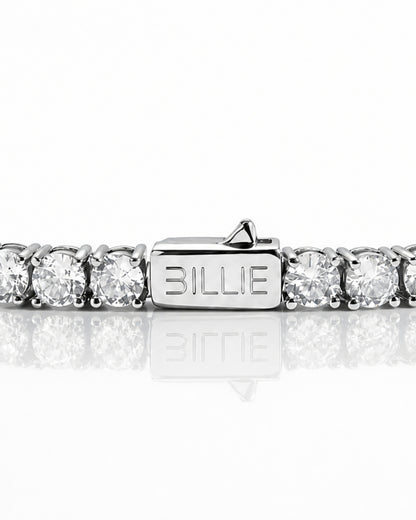 Silver bracelet with circular stones and a clasp marked 'BILLIE'.