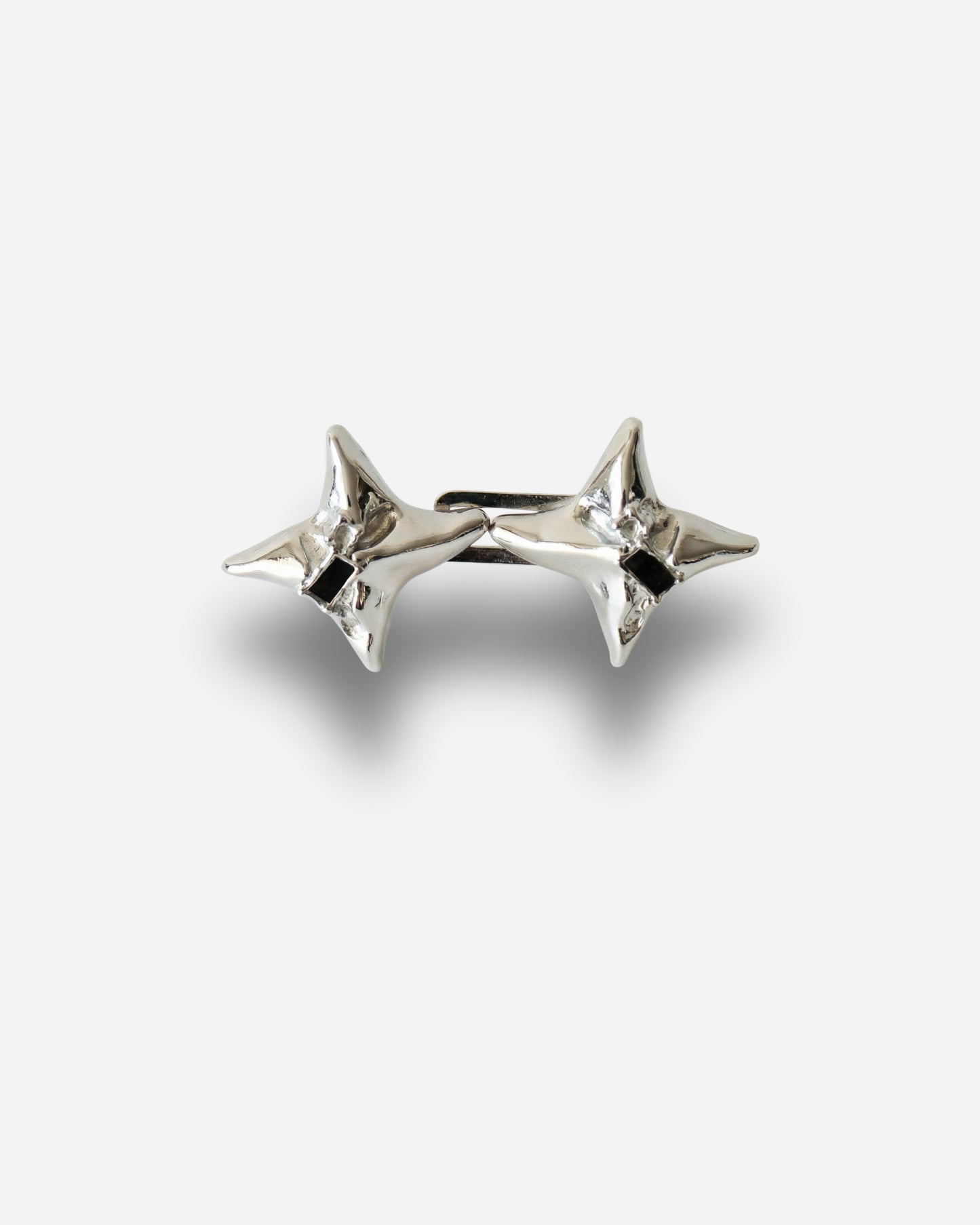 Silver star-shaped earrings with a shiny finish.