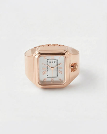 Billie Edge Ring Watch in rose gold, rectangular finger watch with white dial on a light background