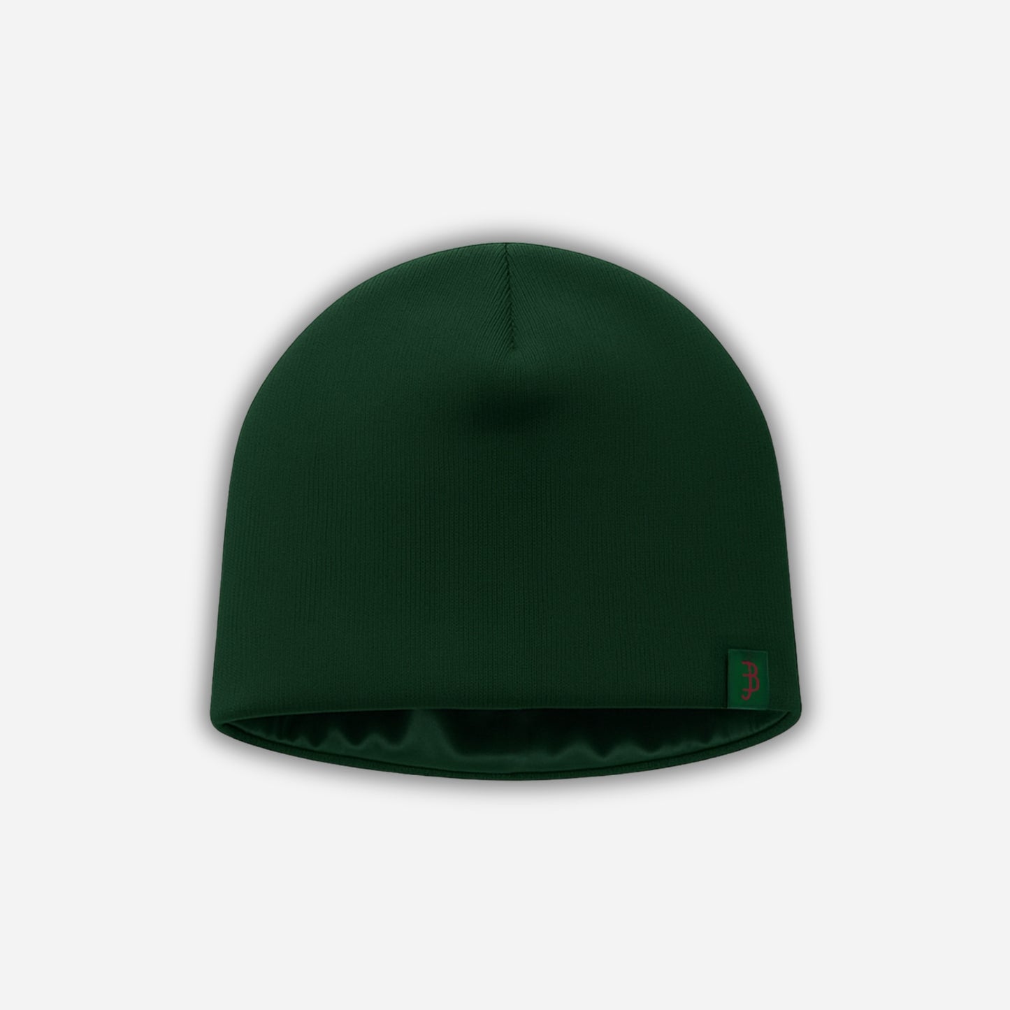 Green beanie hat on a light gray background