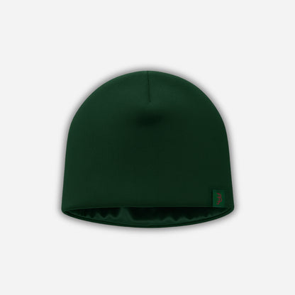 Green beanie hat on a light gray background