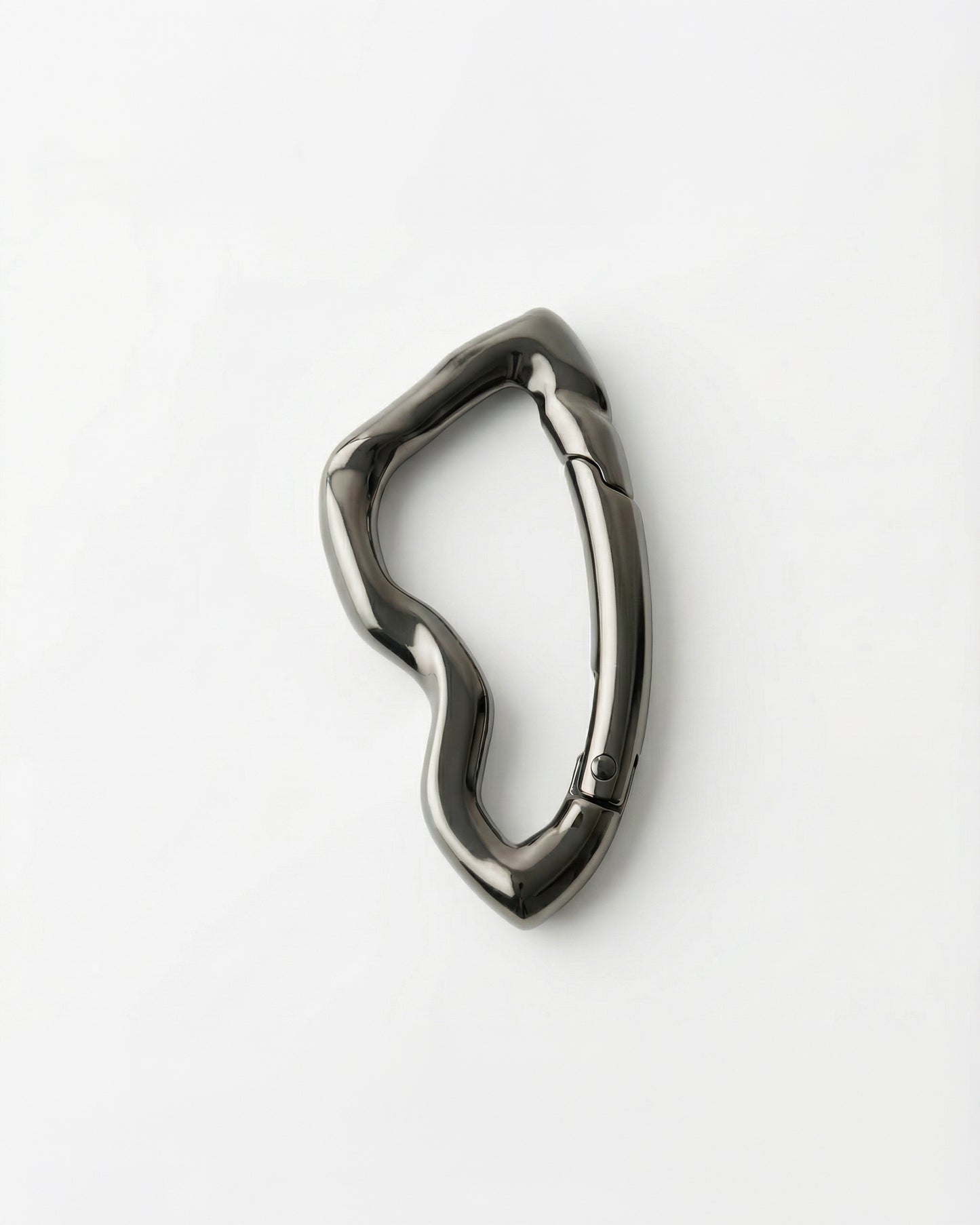 Abstract metallic clip on a plain white background