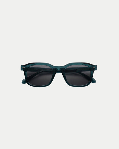 Teal sunglasses with dark lenses on a plain background