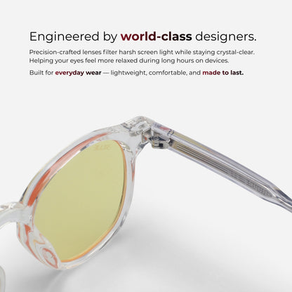 Sunglasses with a clear frame and yellow lens on a white background, featuring text about world-class design and comfort.