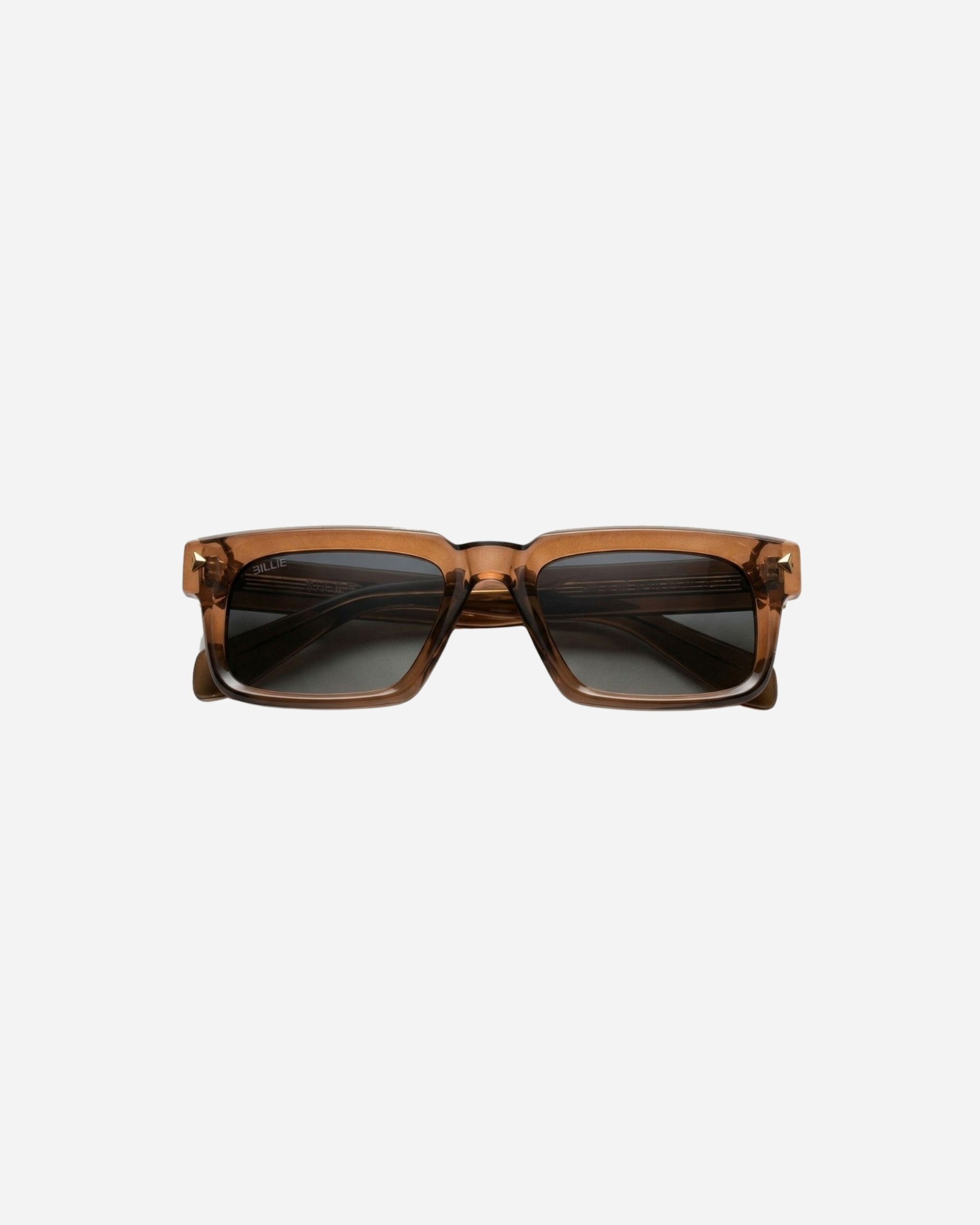 Brown sunglasses with dark lenses on a plain background