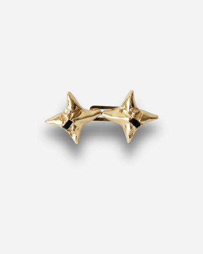 Gold star-shaped earrings with a black detail in the center.