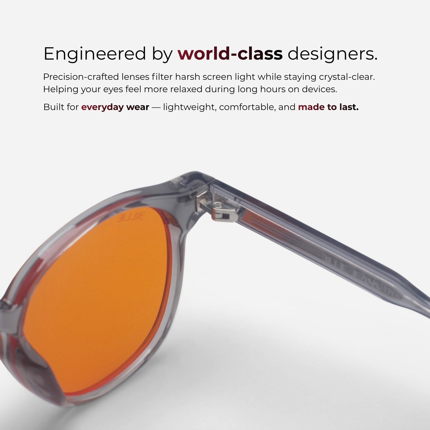 Sunglasses with orange lenses on a white background, featuring text about world-class design and eye comfort.