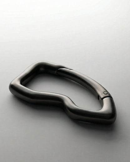 Close-up of the gunmetal black Billie Carabiner Keychain showing the spring clip