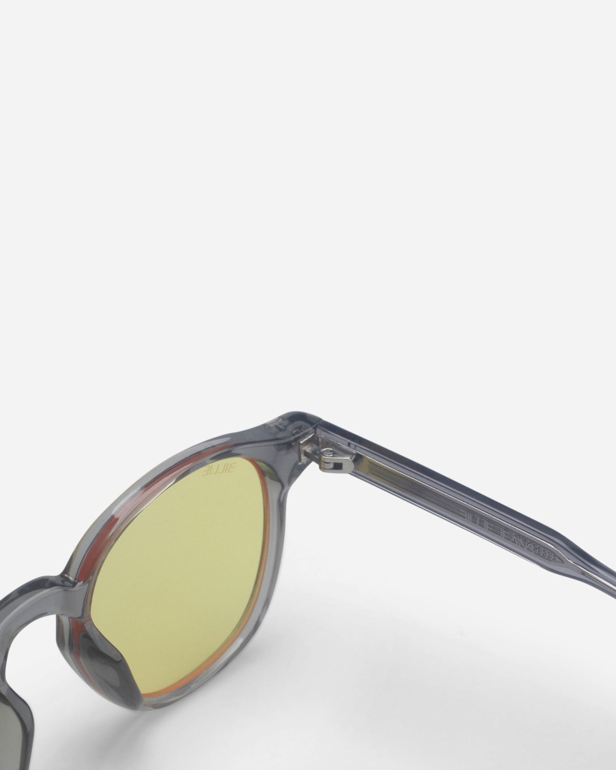 Close-up of the gray frame and yellow lens of the Billie Blue Light Glasses