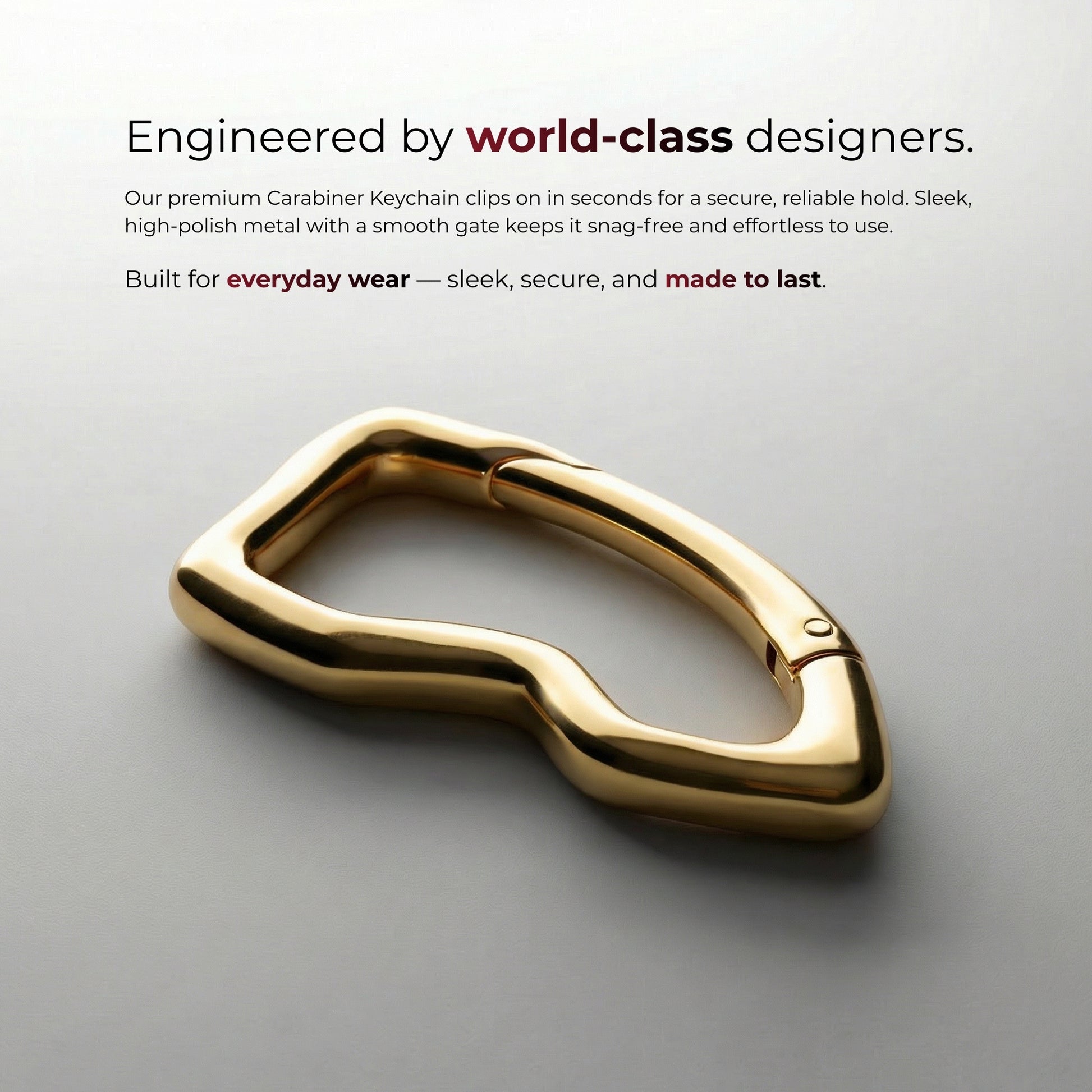 Gold carabiner keychain on a gray background with text about world-class designers and everyday wear.