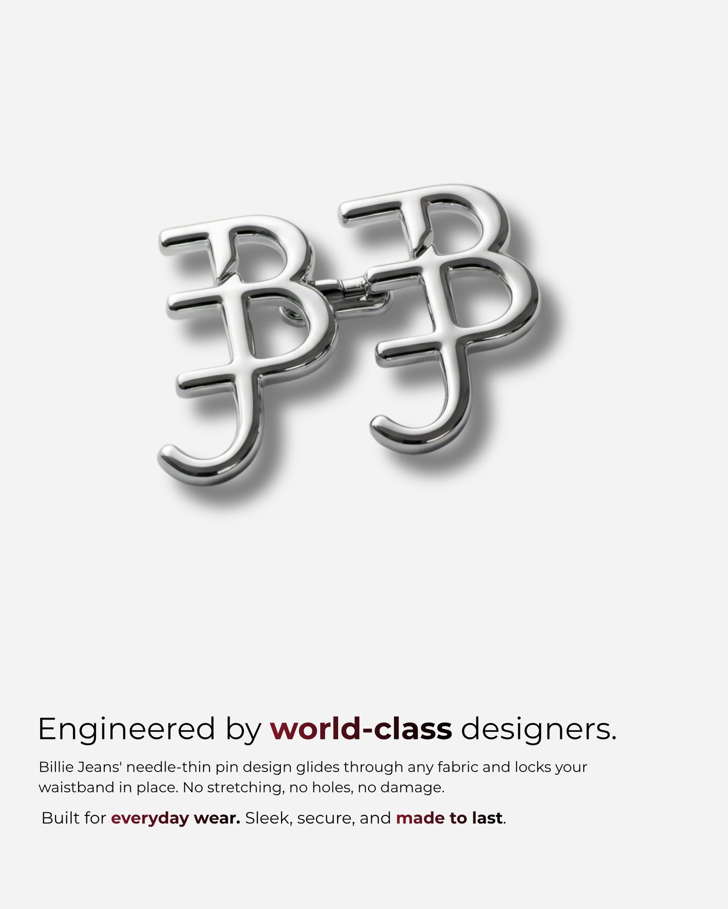 Silver pin design with interlocking letters on a plain background.
