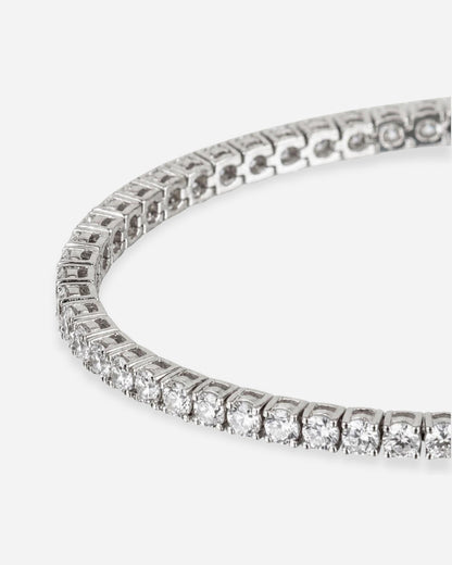 Close-up of a silver bracelet with clear stones set in a row.