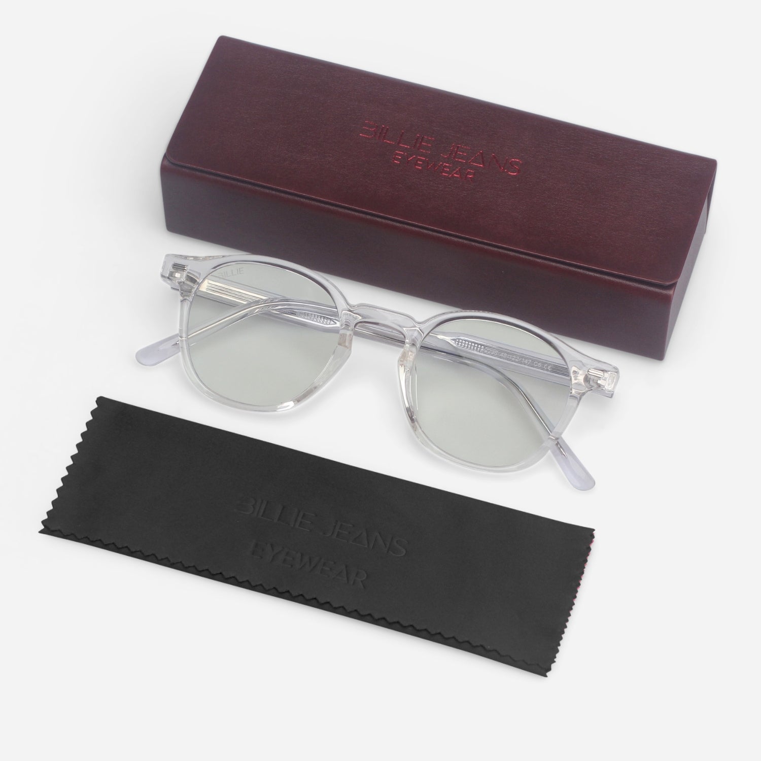 Clear sunglasses with a brown case and black cleaning cloth on a white background