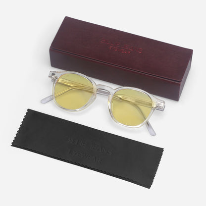 Round sunglasses with yellow lenses and clear frames, accompanied by a maroon case and black cleaning cloth on a white background.