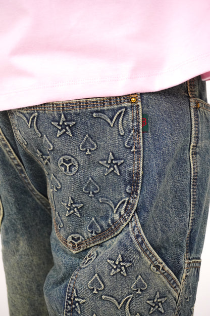 Close-up of blue jeans with patterns on a white background
