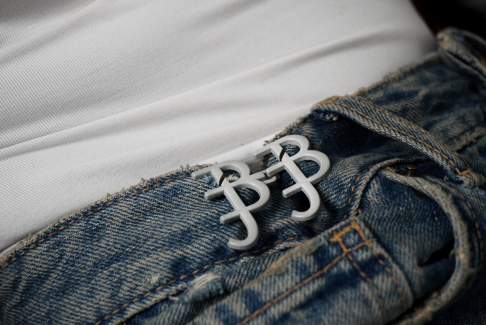Grey signature waist knots on denim