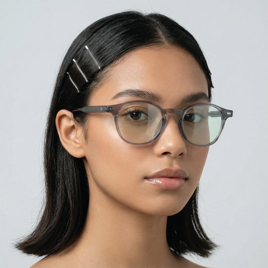 Woman wearing glasses with a plain background