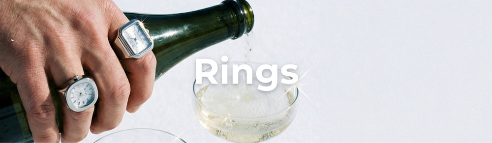 Person pouring champagne with ring watches on. Text overlay: Rings