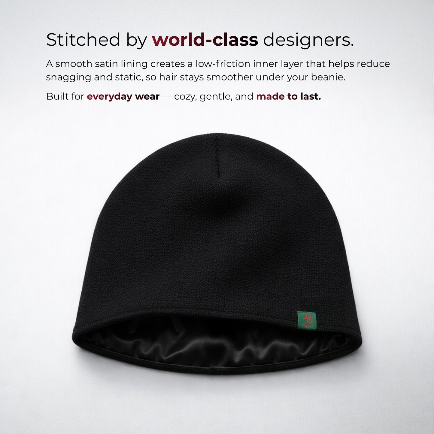 Black beanie with satin lining on a light gray background