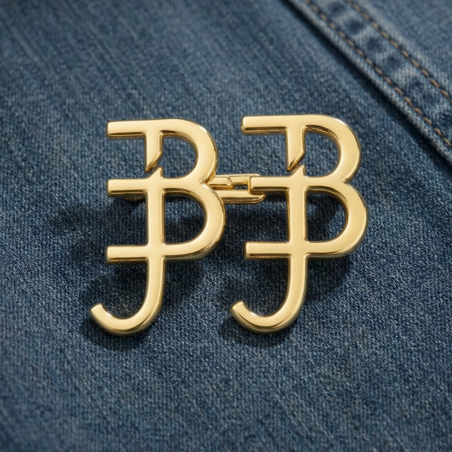 Gold logo on a blue denim background